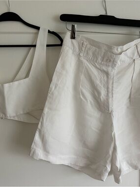 White Women's Bermuda Shorts and top.